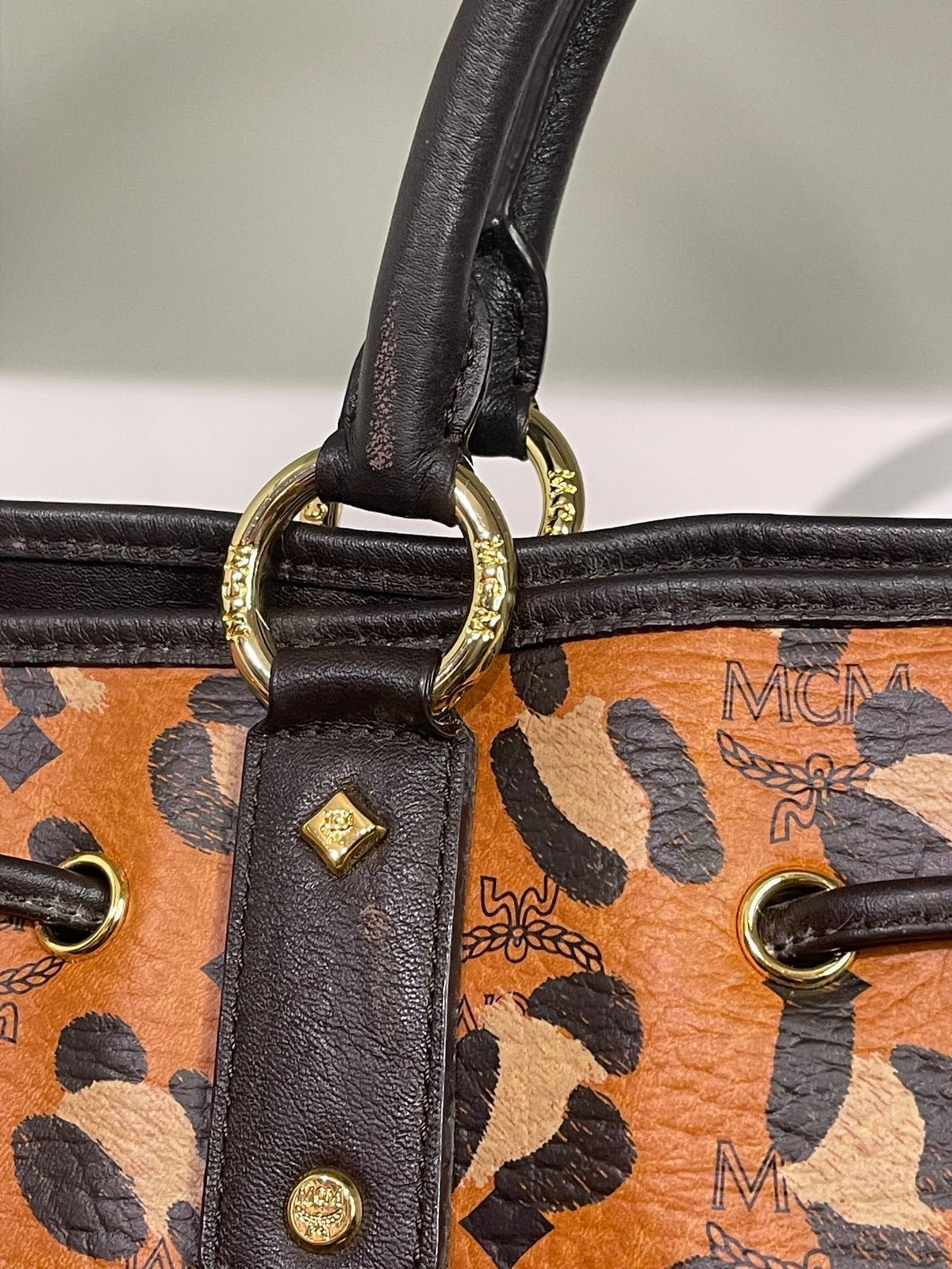 109. MCM Visetos Leopard Print Draw String Shoulder Bag