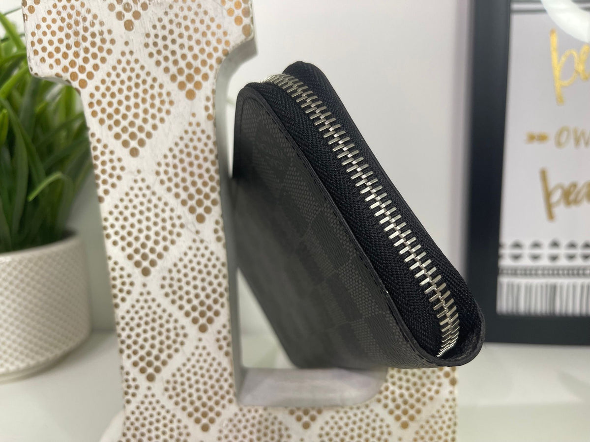 50. Louis Vuitton Damier Graphite Zippy Wallet