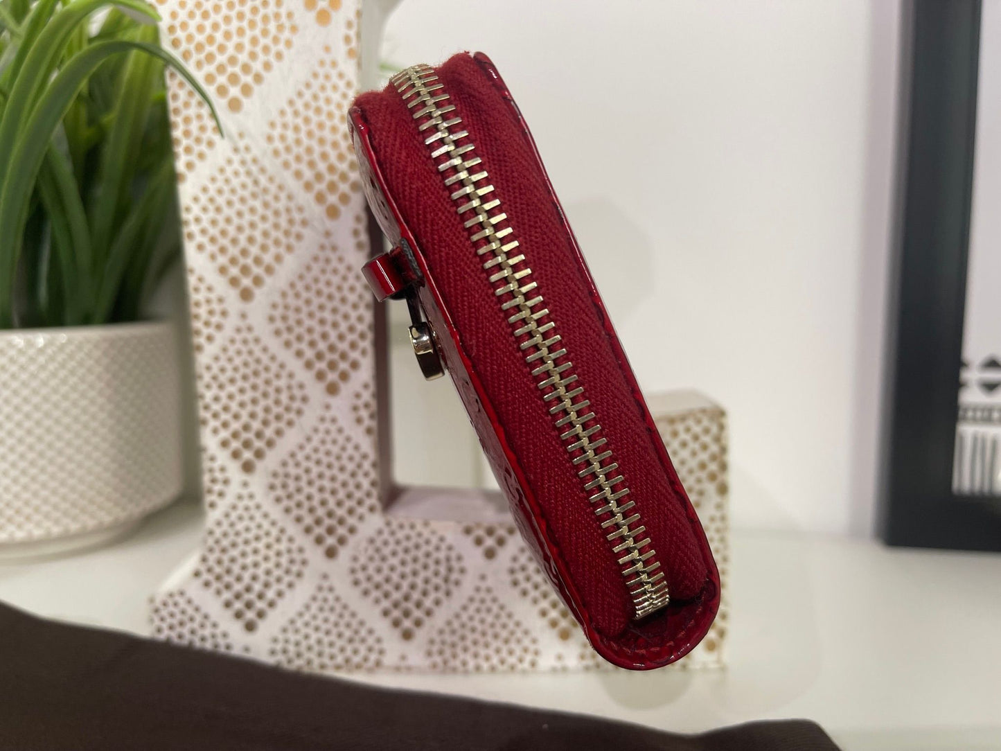 67. Gucci Red Patent Zippy Wallet