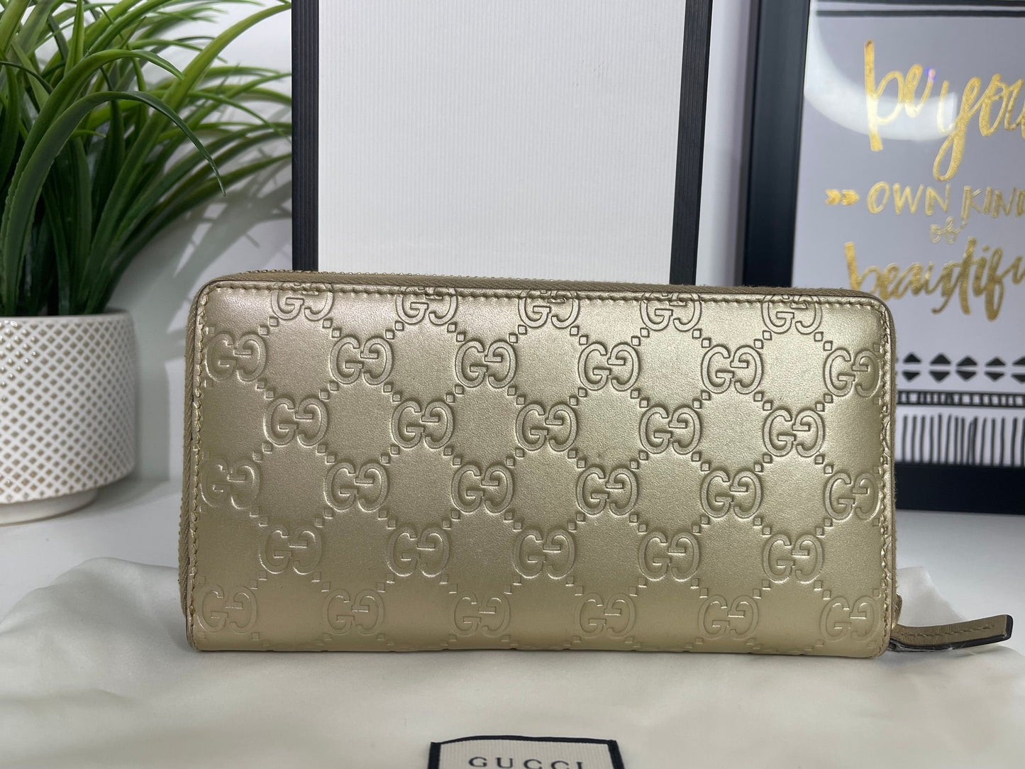 108. Gucci Metallic Gold Zippy Wallet