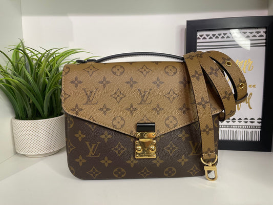 94. Louis Vuitton Reverse Monogram Pouchette Metis
