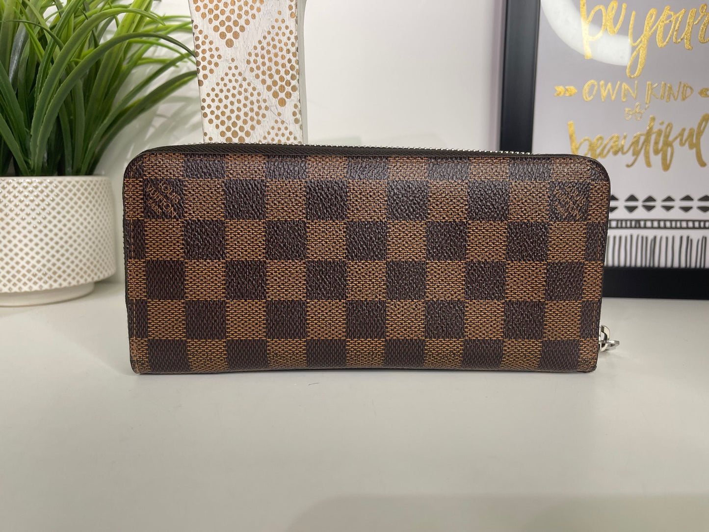 43. Louis Vuitton Damier Ebene Zippy Wallet