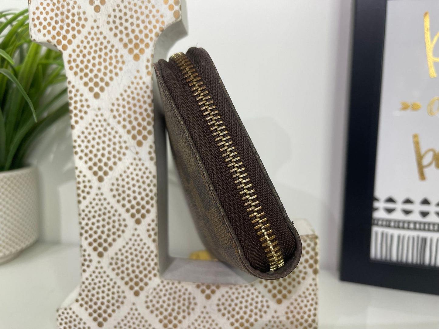 95. Louis Vuitton Damier Ebene Zippy Wallet