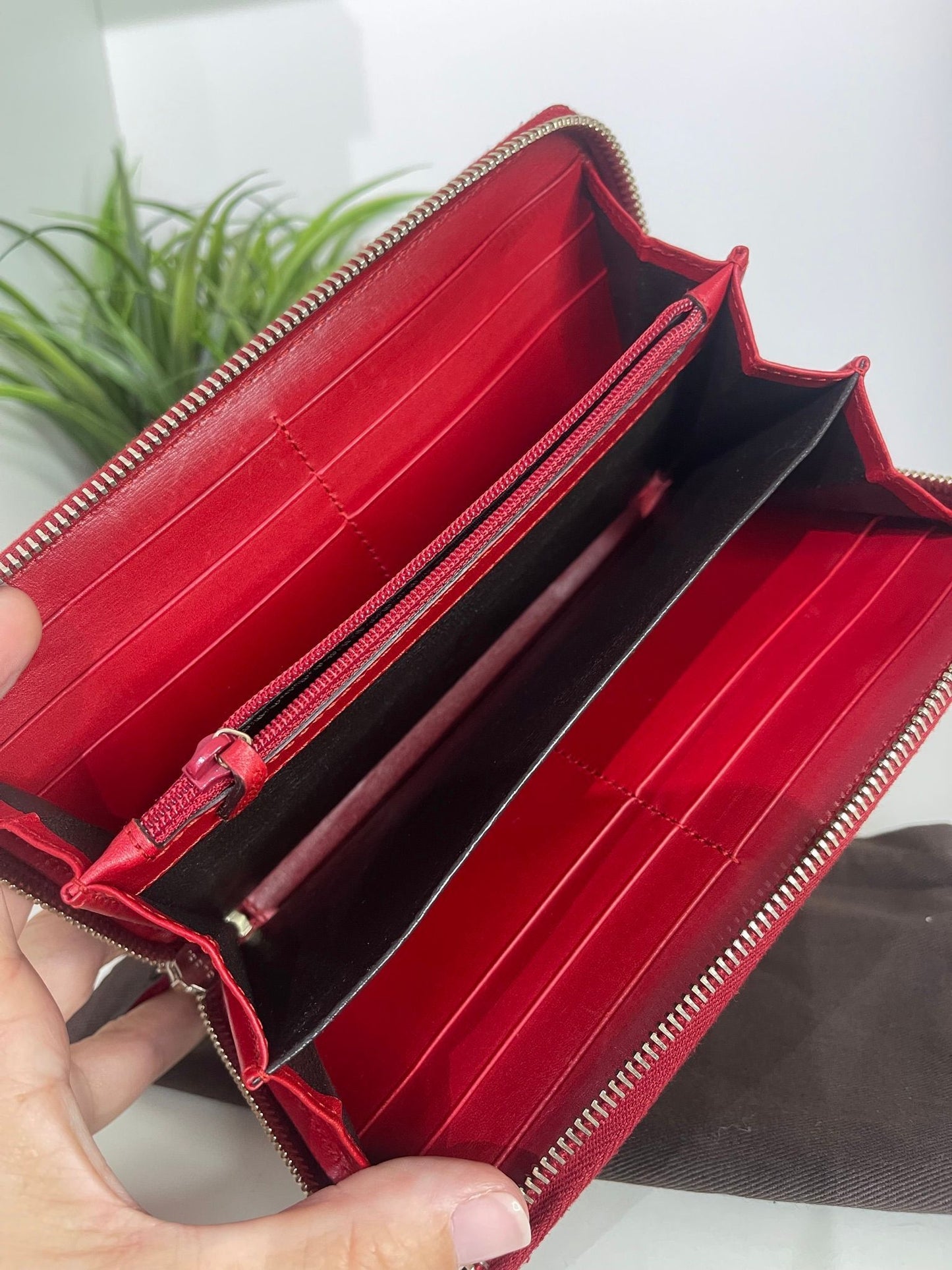 67. Gucci Red Patent Zippy Wallet