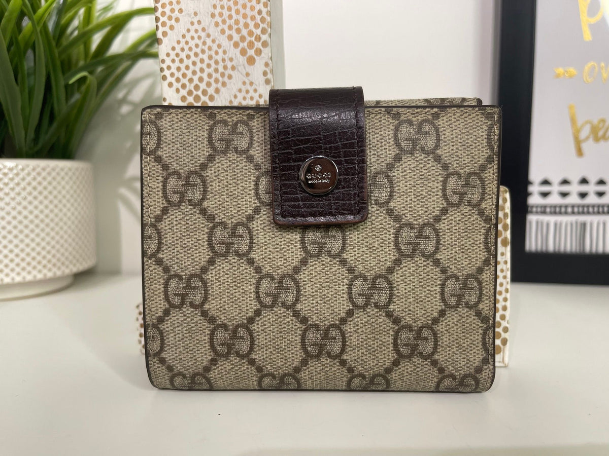 86. Gucci Supreme Compact Wallet