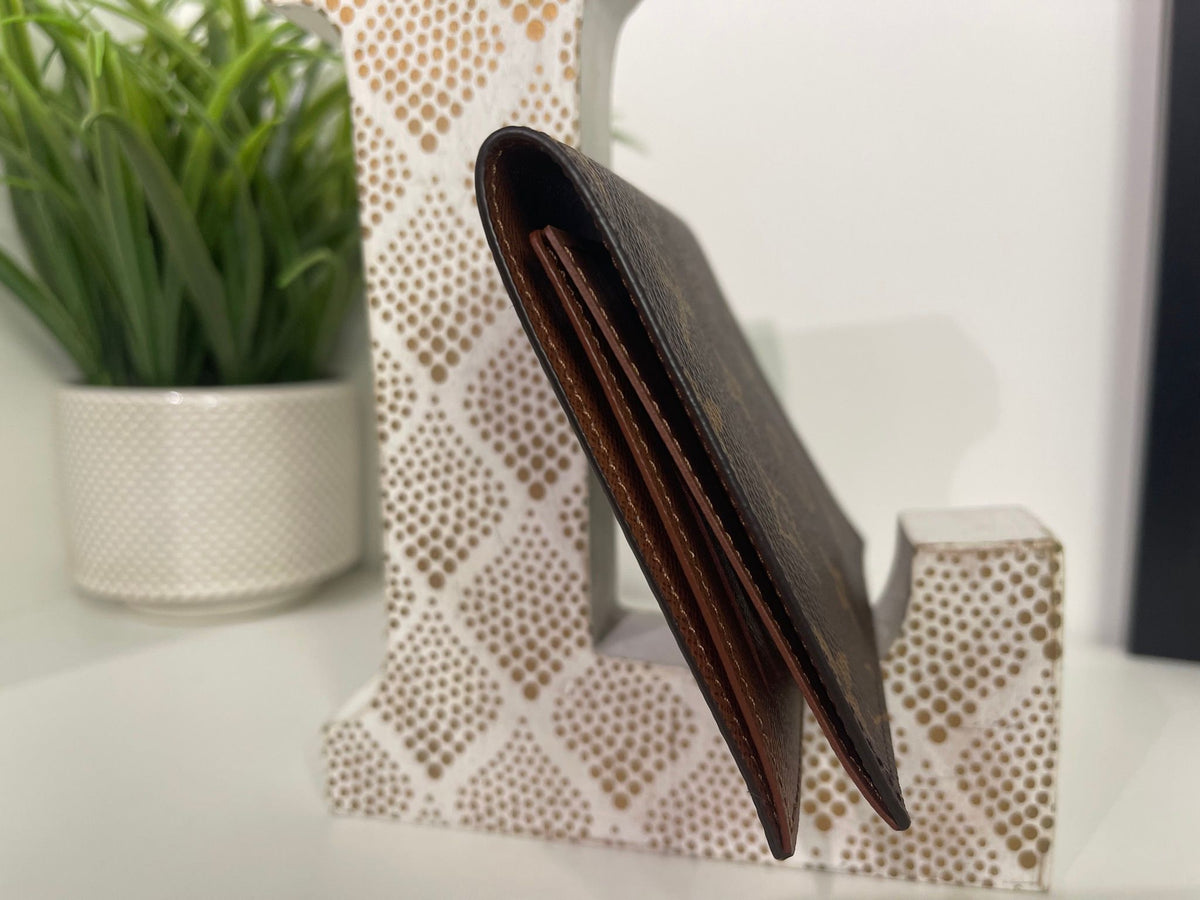 84. Louis Vuitton Monogram Passport Cover