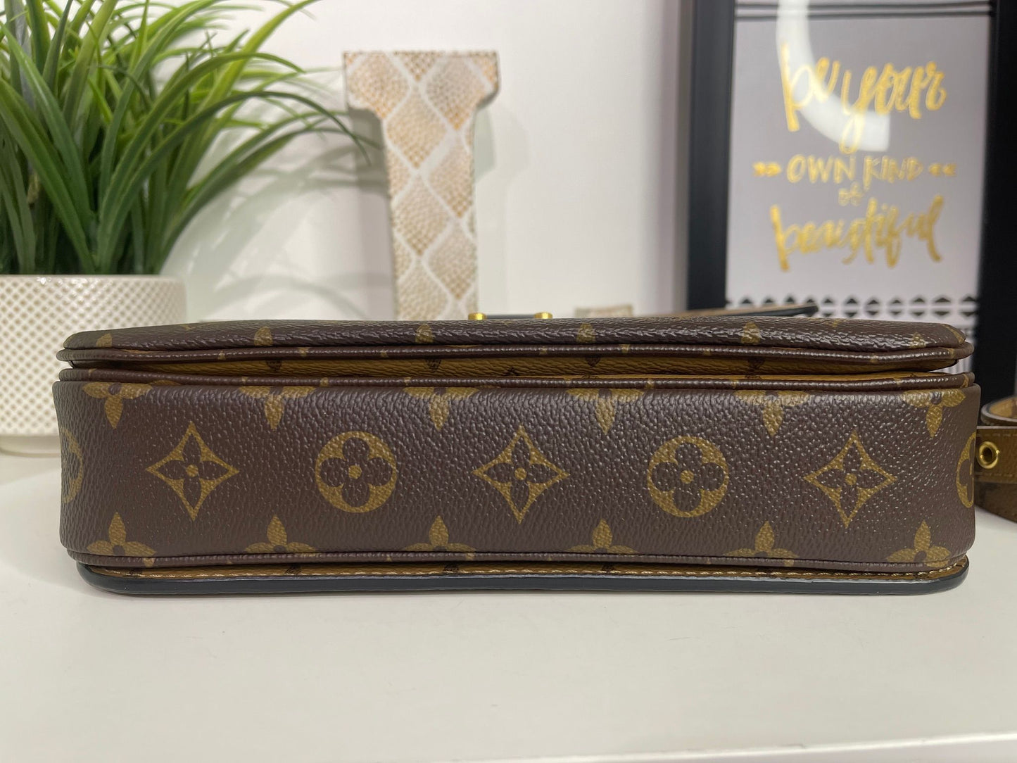 94. Louis Vuitton Reverse Monogram Pouchette Metis