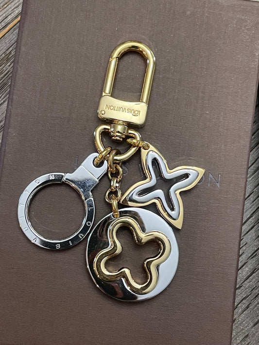 17. Louis Vuitton Insolence Silver/Goldtone Bag Charm
