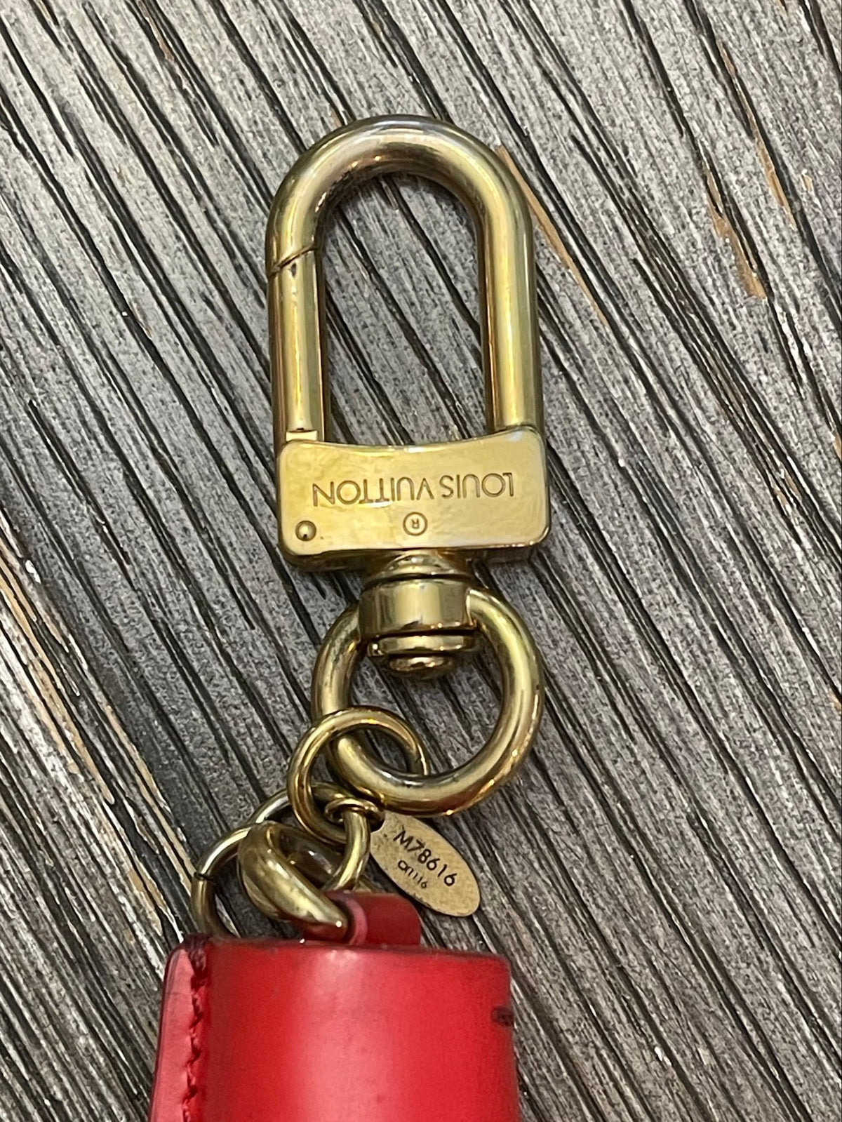 44. Louis Vuitton Tassel Charm Red/Monogram