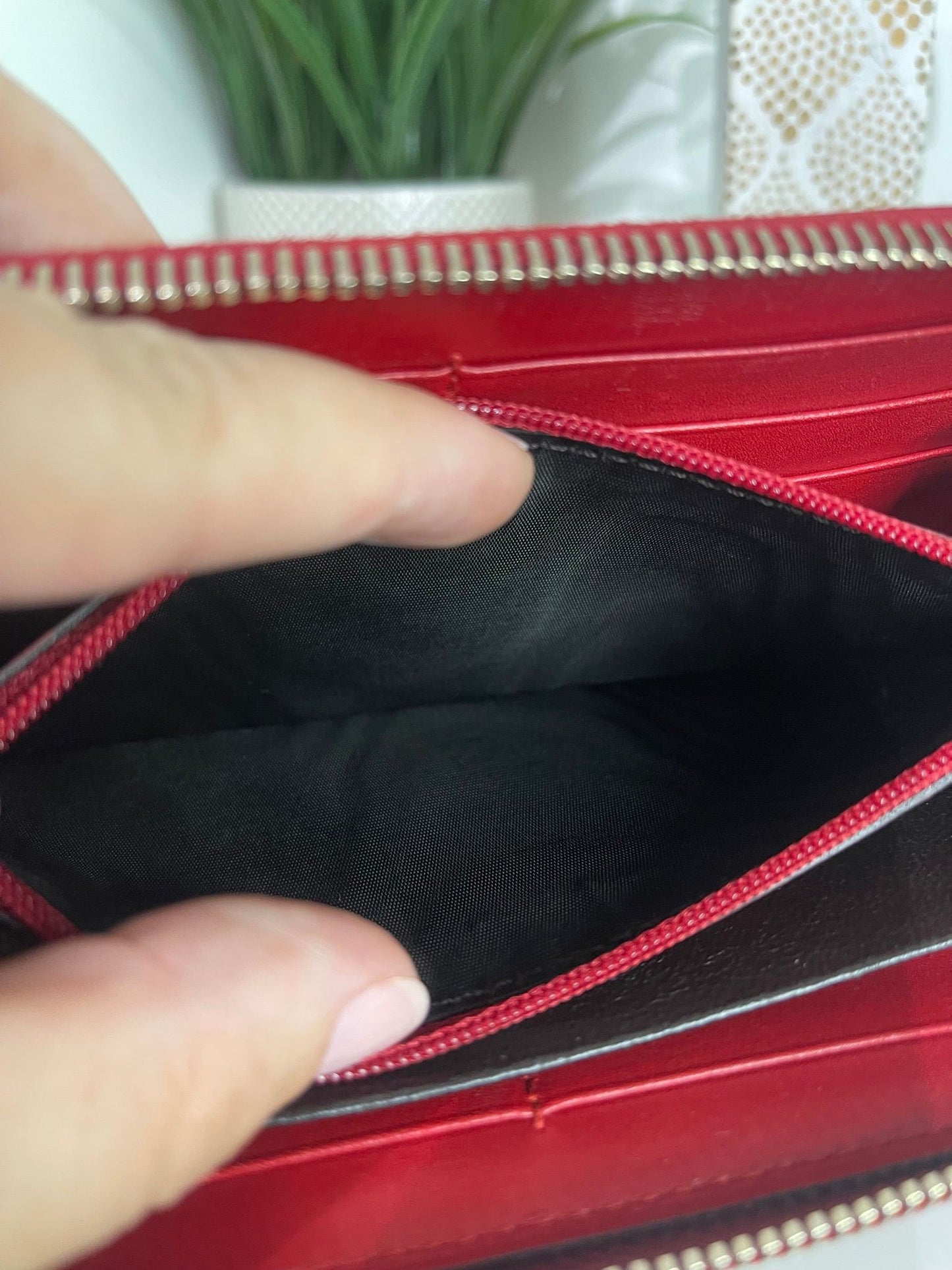 67. Gucci Red Patent Zippy Wallet