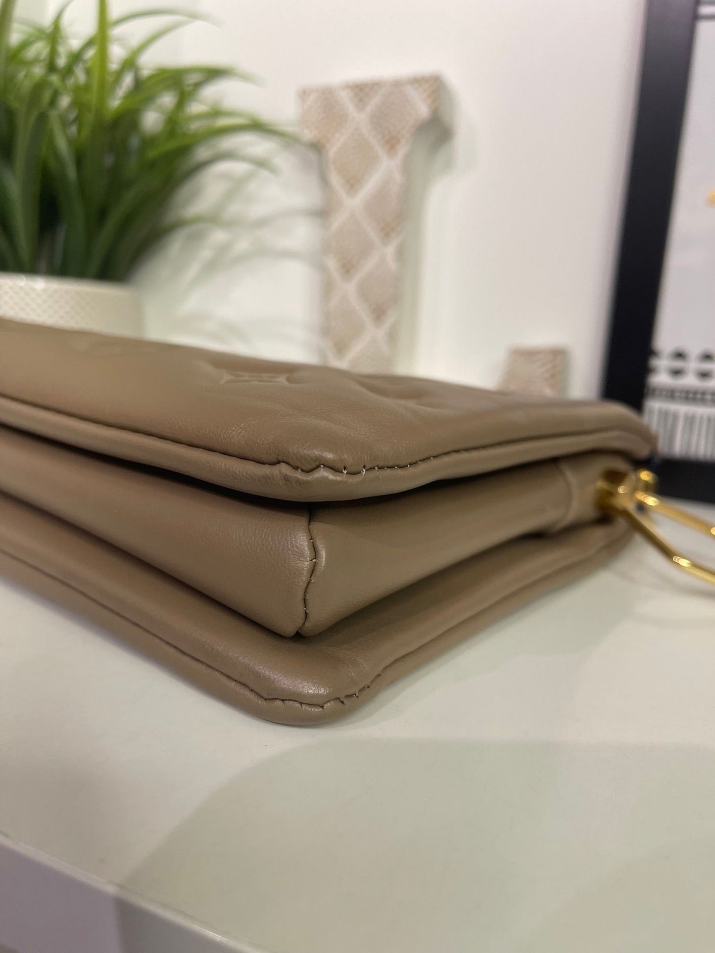 88. Louis Vuitton Mocha Coussin PM