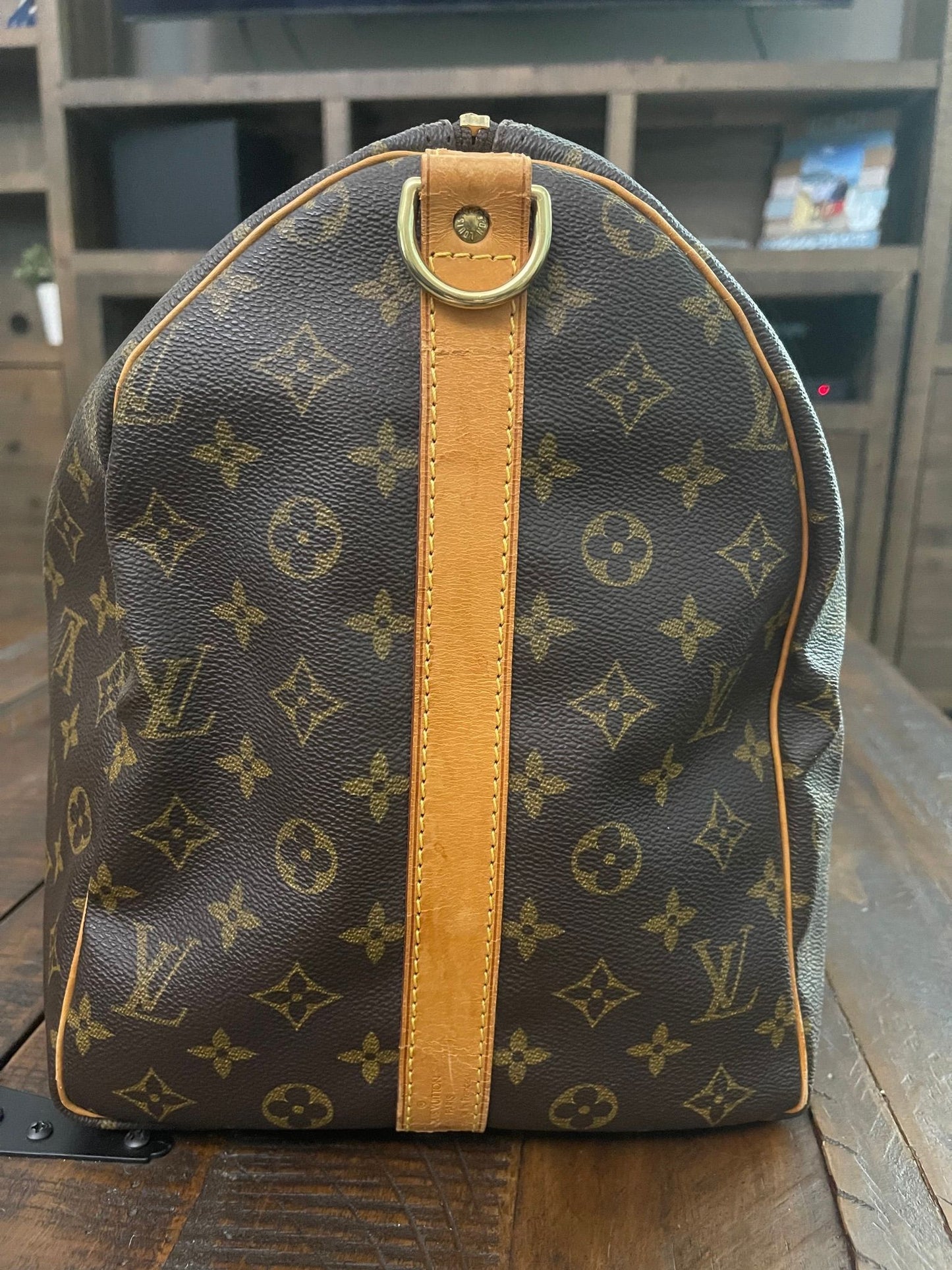 38. Louis Vuitton KeepAll 50 Bandolier (NO STRAP)